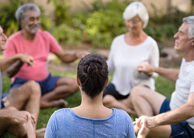 Elderly couple meditating